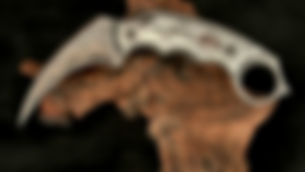 (SOLD)  Copper Damascus Karambit