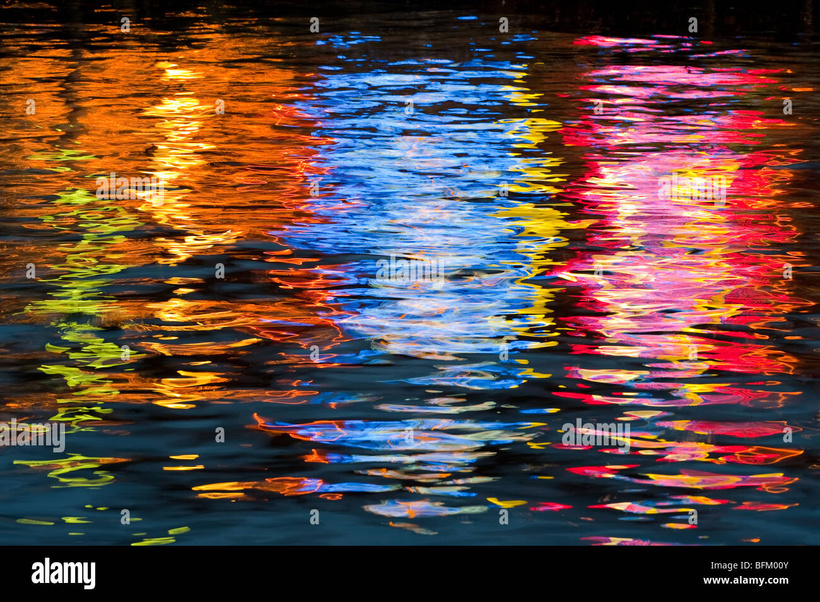 It's an image of different colored lights on the water. 