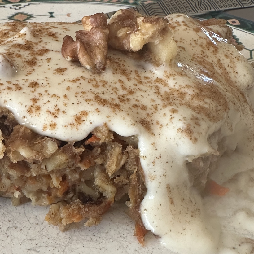 Baked carrot cake oatmeal w/ silken tofu maple icing.