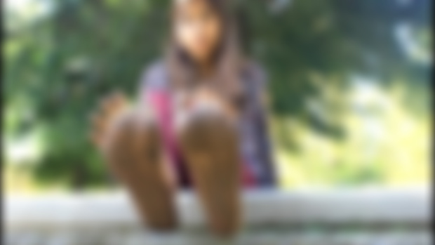 Aracely barefoot on mud clip captures